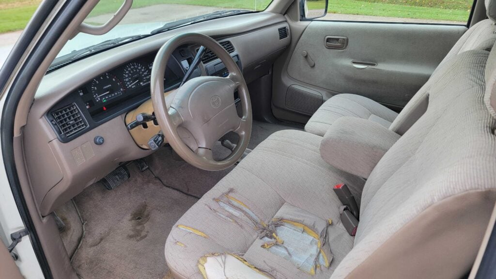 Interior cabin view of 1998 Toyota T100 DX 4x4 showing seats and dash