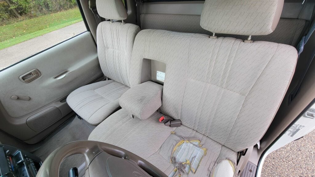 Front seat interior of 1998 Toyota T100 DX 4x4 showing upholstery condition