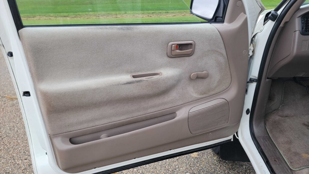 Interior driver-side door panel of 1998 Toyota T100 DX 4x4