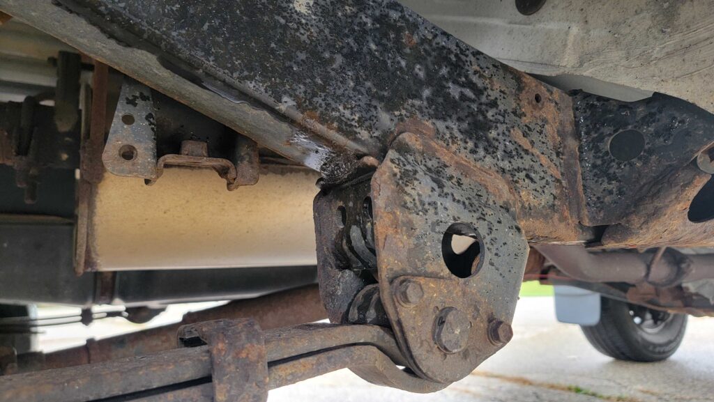 Rear passenger-side frame and underbody view of 1998 Toyota T100 DX 4x4