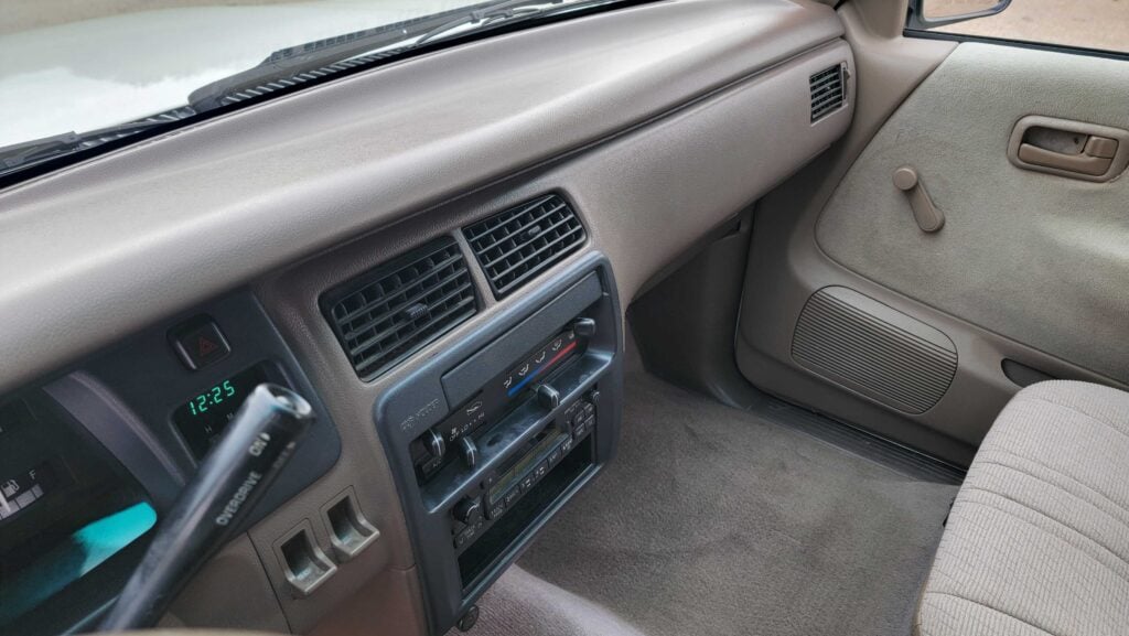 Upper dashboard and steering area of 1998 Toyota T100 DX 4x4