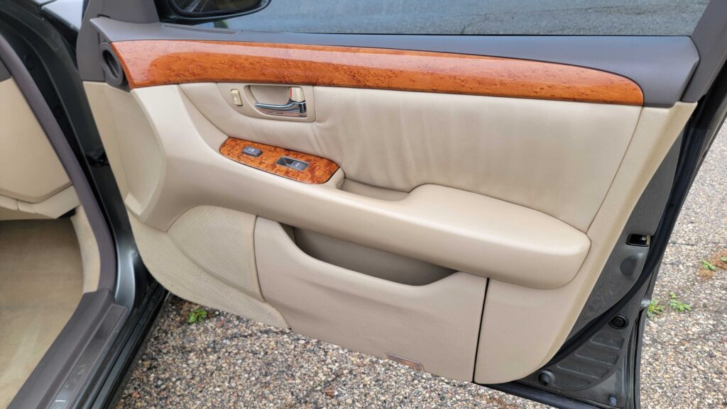 Front passenger door interior with controls and trim of 2005 Lexus LS430