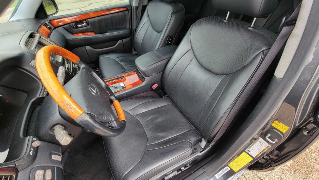 Rear cabin seating area of 2006 Lexus LS430 ULTRA showing tan leather and luxury trim