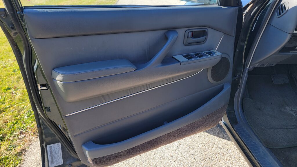 Driver door panel of 1994 Toyota Land Cruiser green triple locked