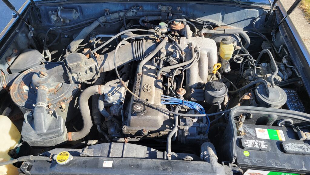 Engine bay view of 1994 Toyota Land Cruiser green triple locked