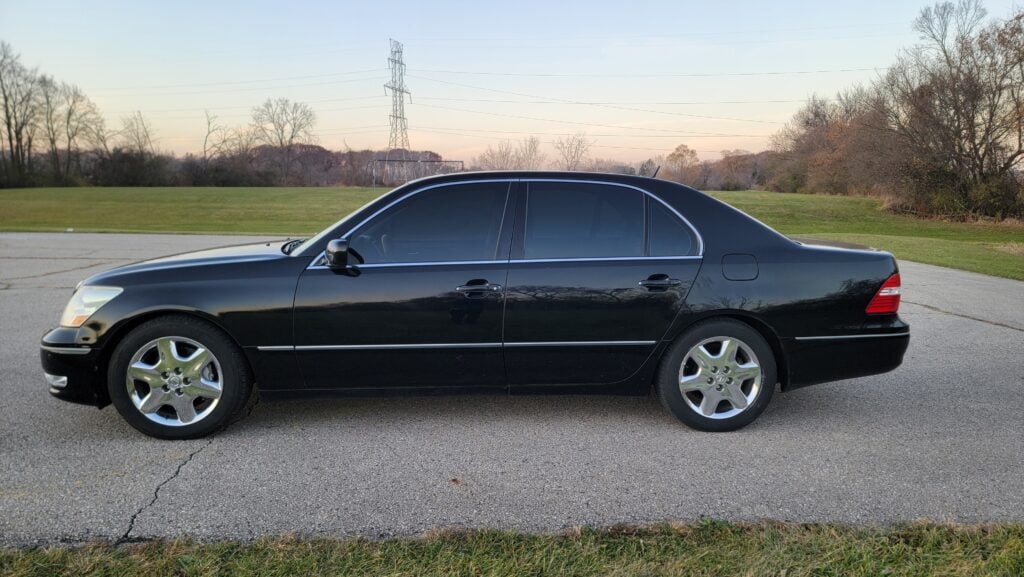 Driver side profile of black 2004 Lexus LS430