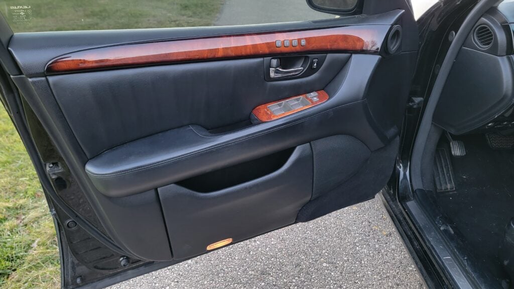 Driver front door panel of black-on-black Lexus LS430