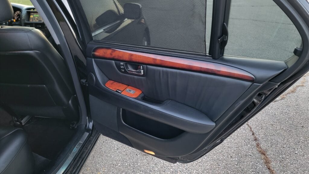 Passenger rear door panel of Lexus LS430 black interior