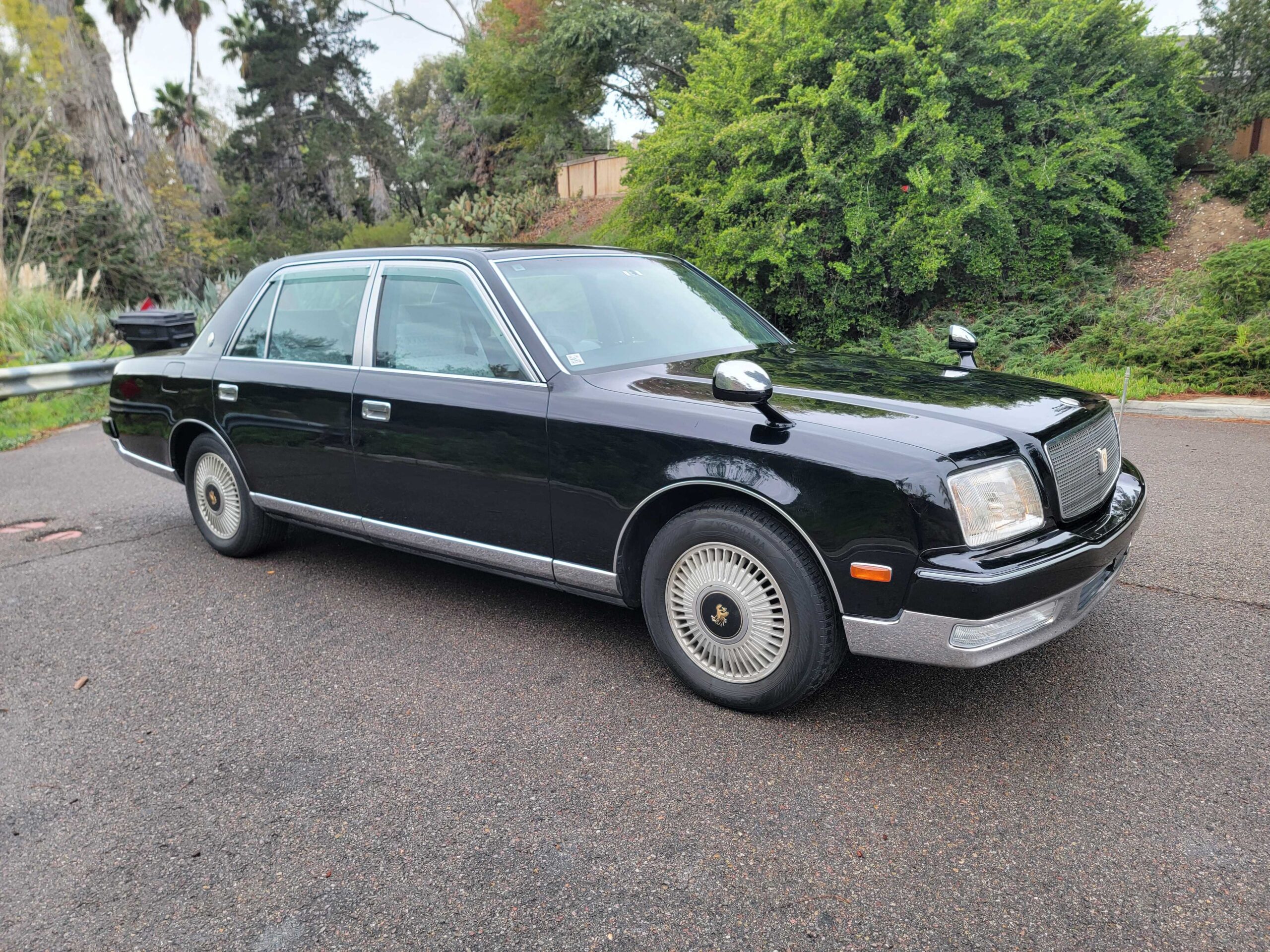 Front driver-side angle of 1998 Toyota Century right-hand drive in black