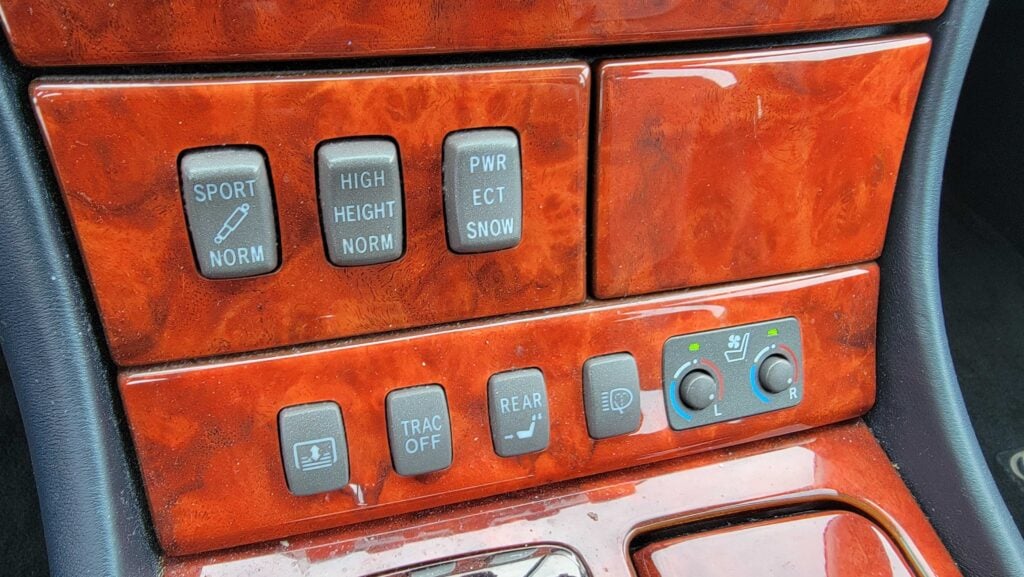 Center console switches and wood trim close-up