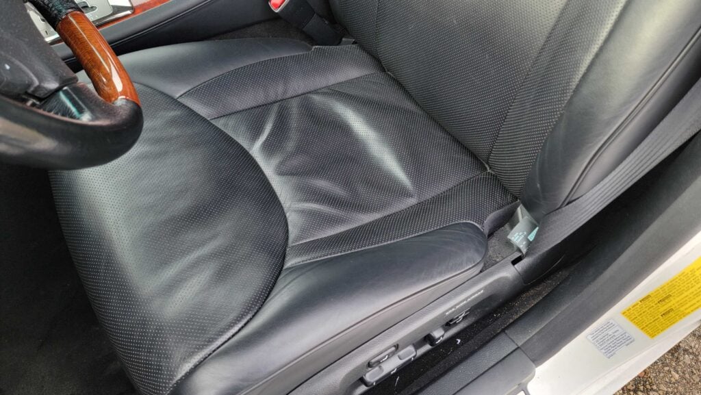 Driver seat close-up in black leather