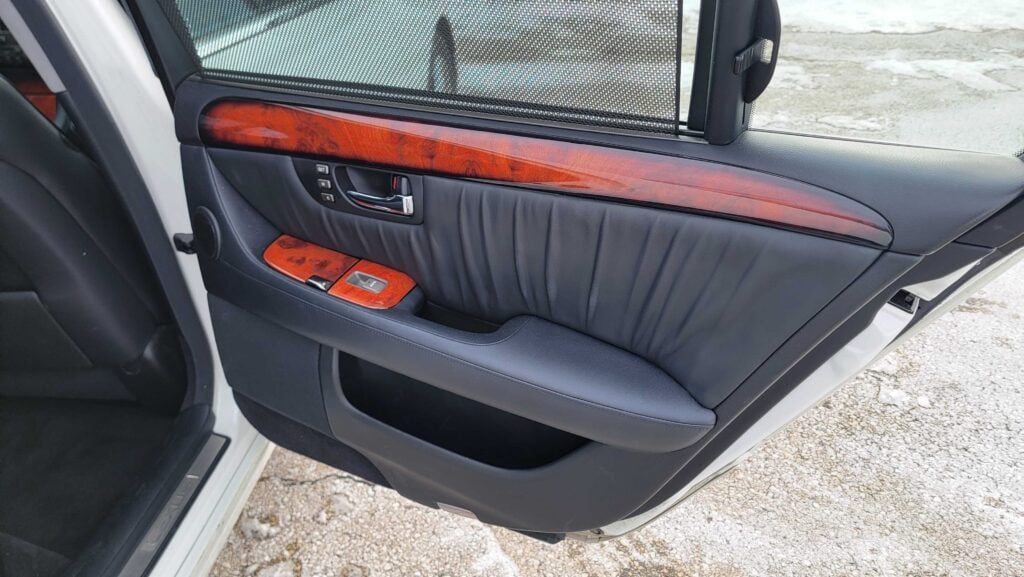 Passenger rear door panel with wood trim