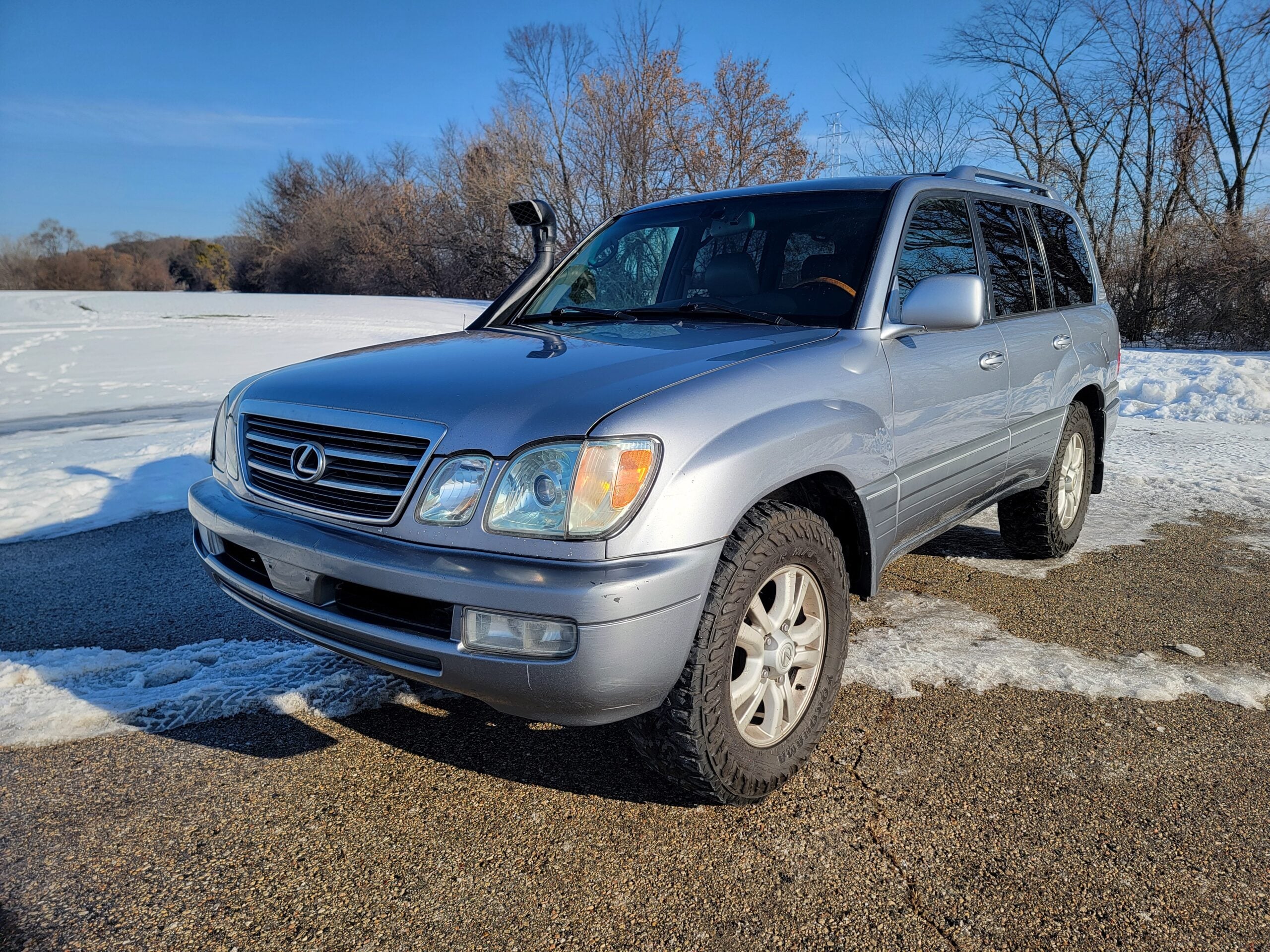 Front driver-side angle of silver Lexus LX470