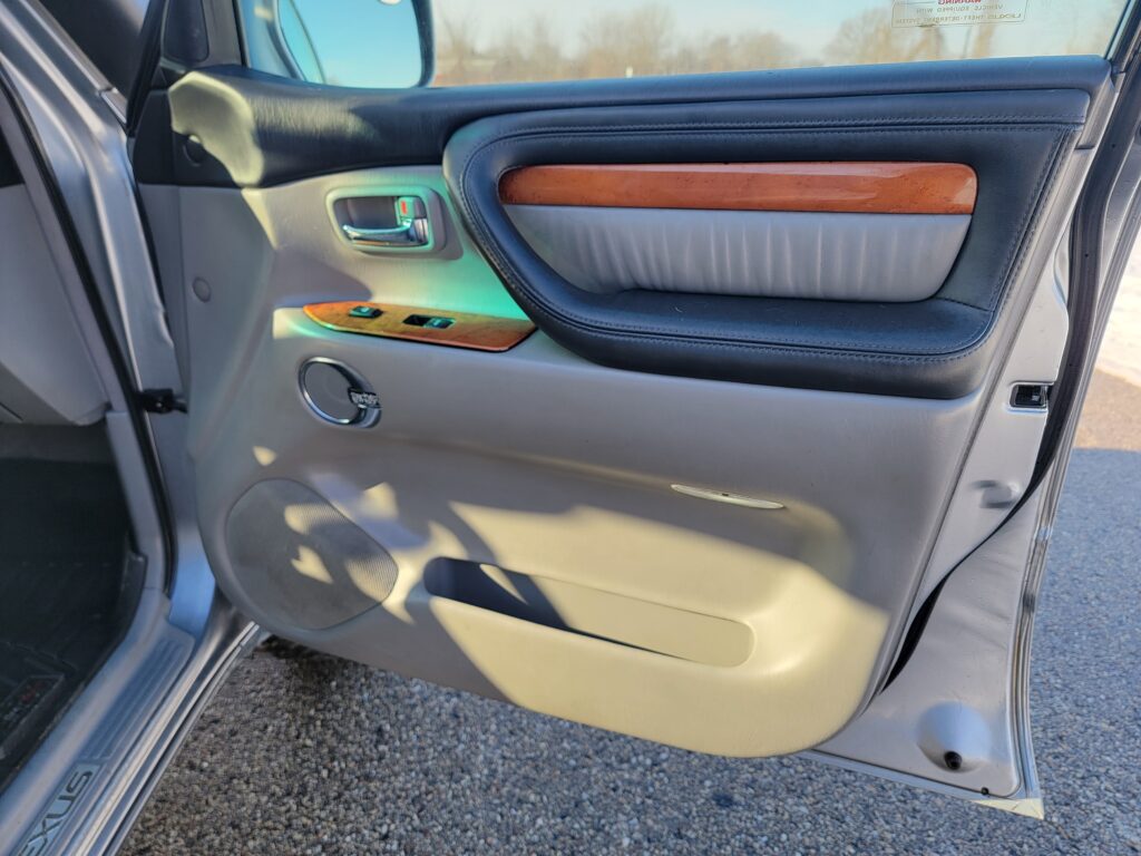 Passenger front door panel with wood trim on Lexus LX470