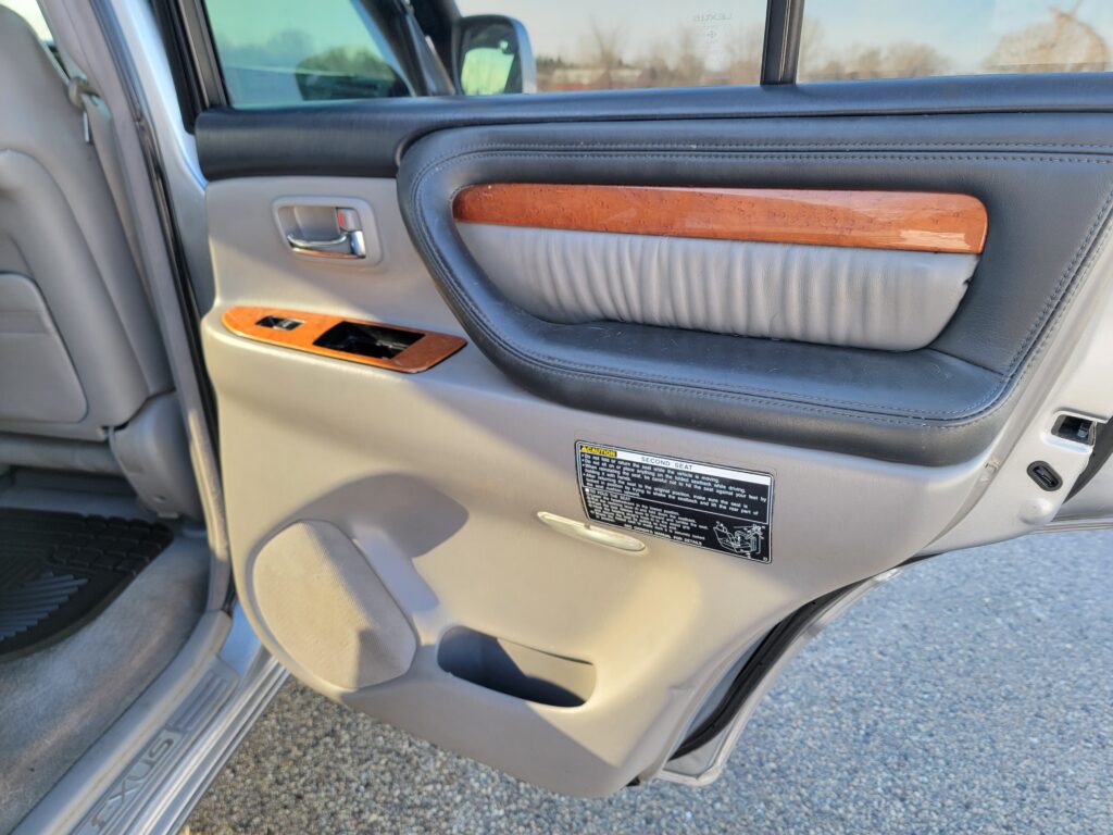 Passenger rear door panel with wood trim on Lexus LX470