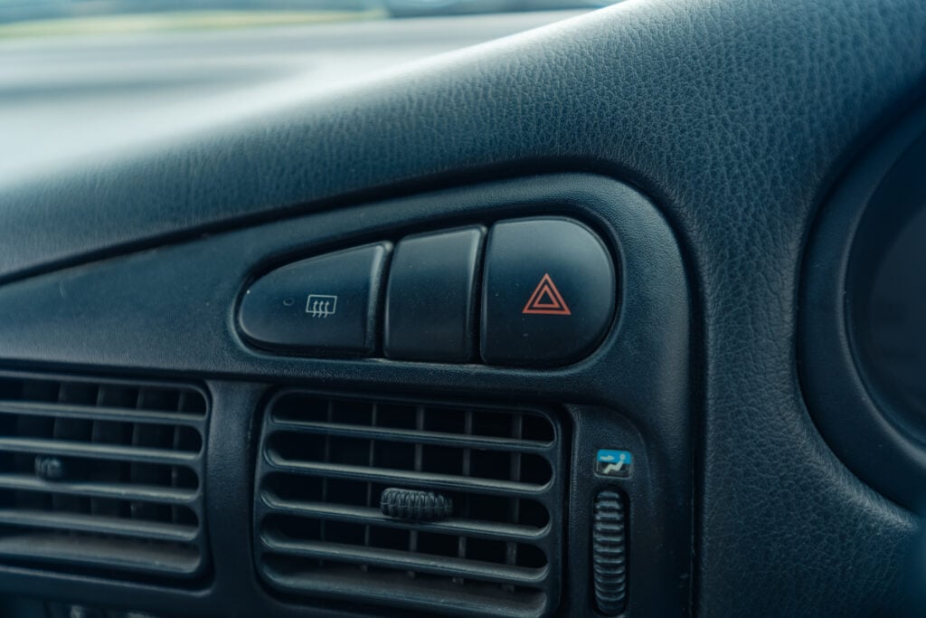 1995 Mitsubishi EVO 3 hazard and defrost buttons
