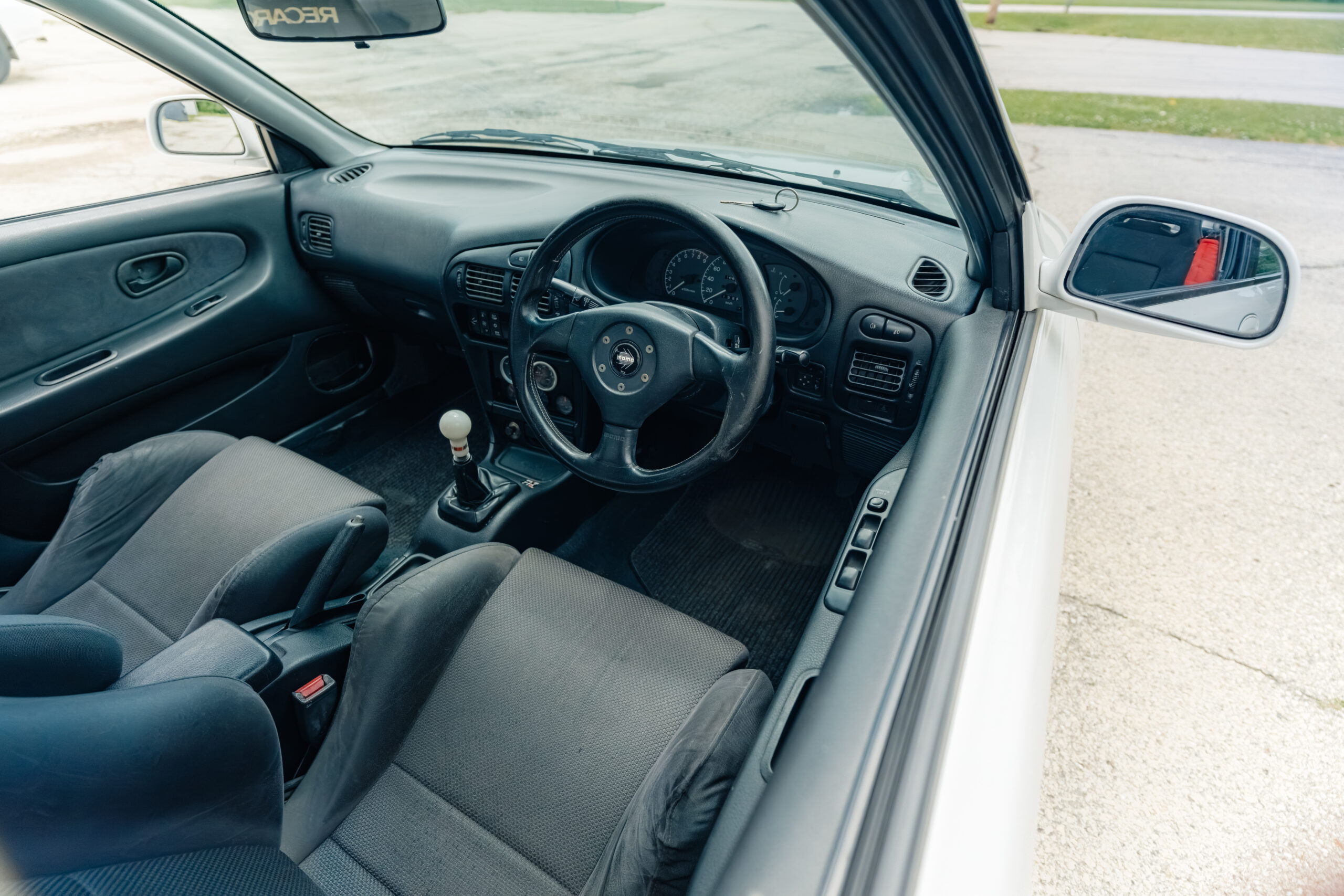 1995 Mitsubishi EVO 3 steering wheel view from outside driver window