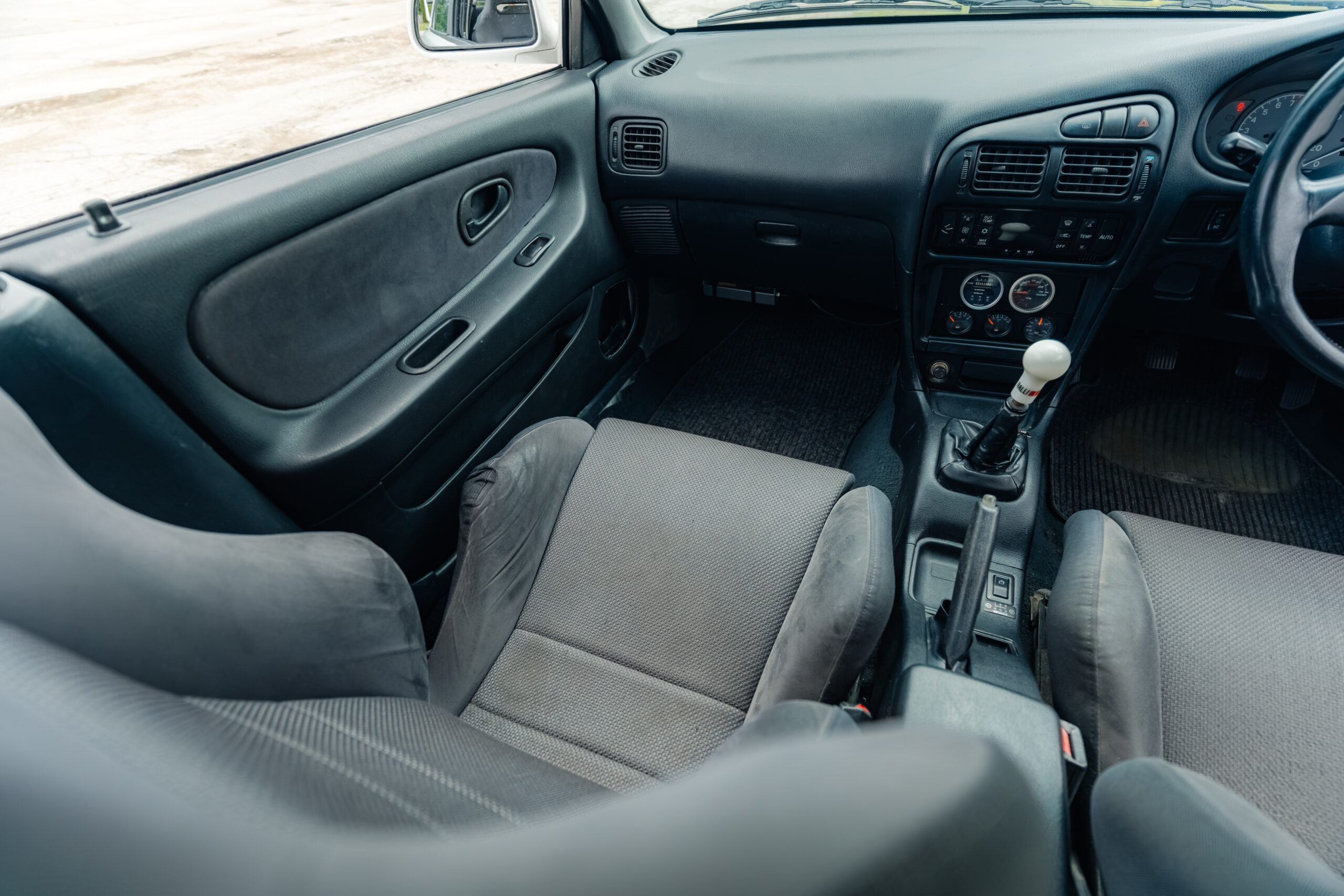 1995 Mitsubishi EVO 3 passenger front seat view from rear seat