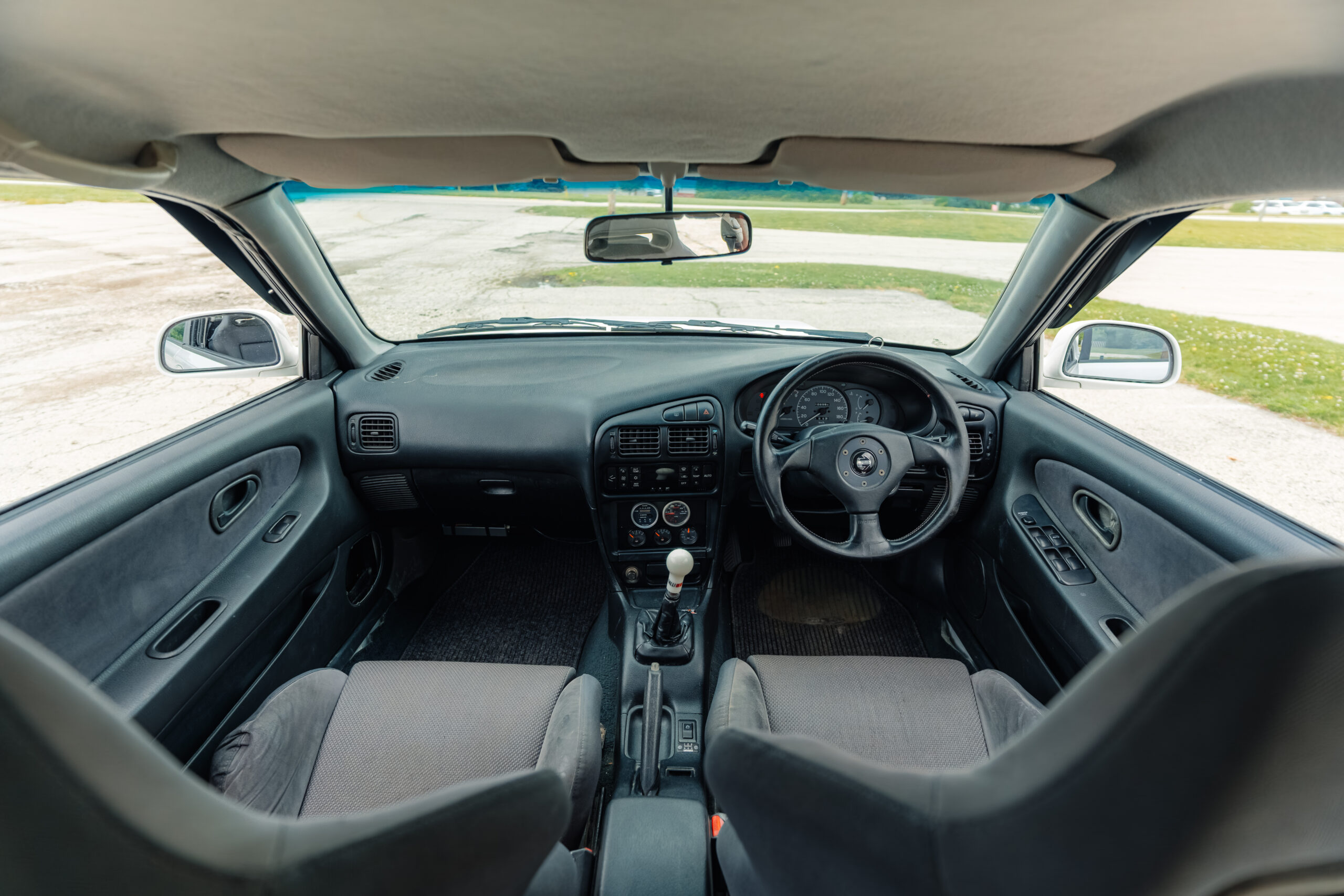 1995 Mitsubishi EVO 3 front seat view from back seats
