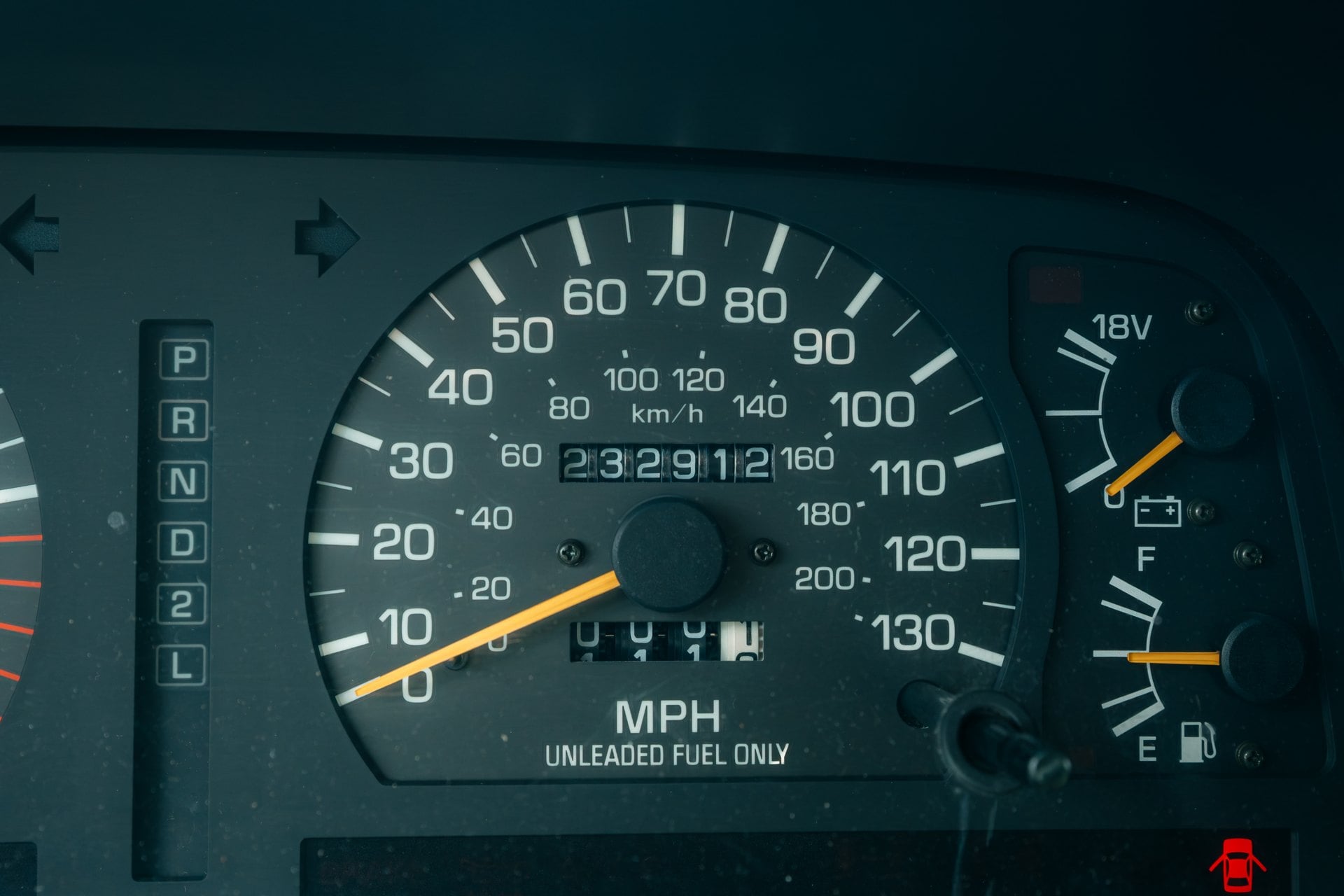 1997 Toyota Land Cruiser odometer displaying 232,912 miles in the supplied photo