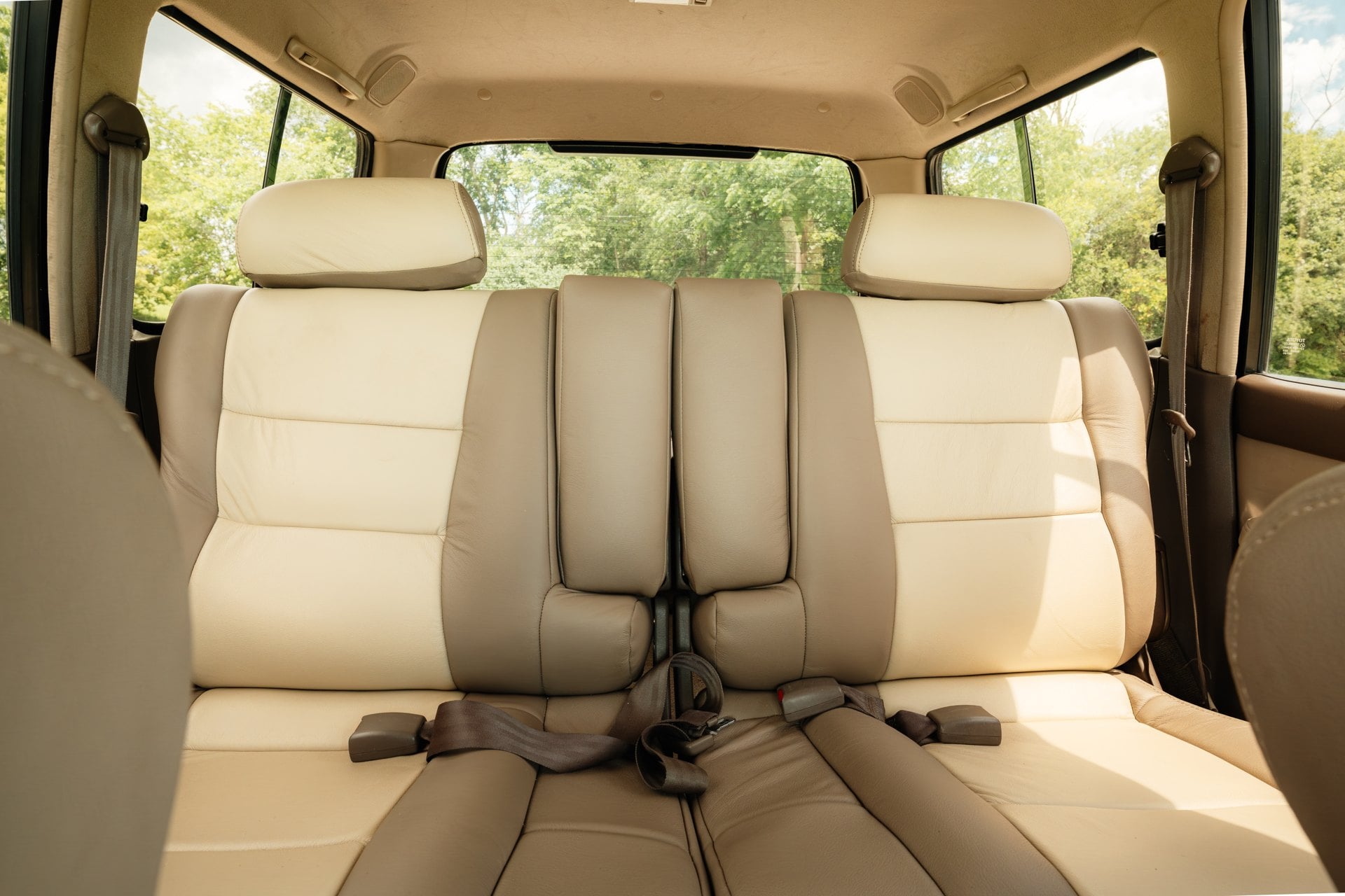 Tan rear seats in the 1997 Toyota Land Cruiser 40th Anniversary
