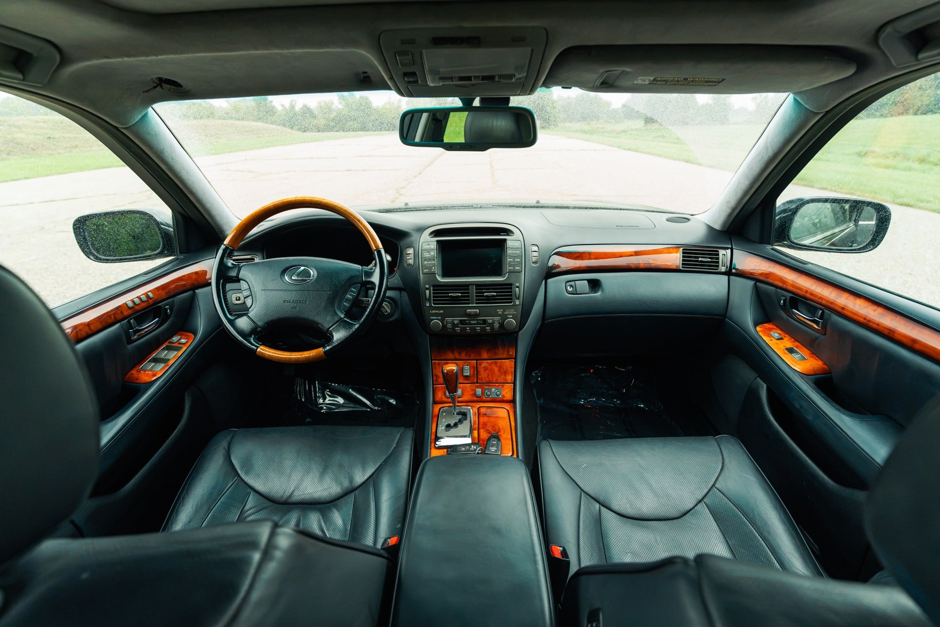 2005 Lexus LS430 CL stock 3704: black leather front cabin, wood trim, and factory navigation